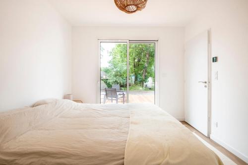 En eller flere senge i et værelse på Villa Bassin d'Arcachon