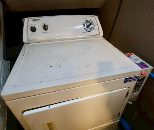 a white refrigerator freezer sitting inside of a box at Sampheng House in Bangkok