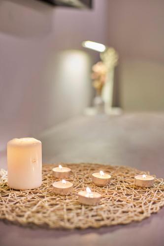a group of candles sitting on top of a table at Modern Studio Empire Damansara, Near 1 Utama & IKEA in Petaling Jaya