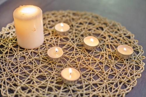 a group of candles sitting on a wreath with a candle at Modern Studio Empire Damansara, Near 1 Utama & IKEA in Petaling Jaya