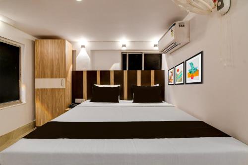 a bedroom with two beds in a room at Hotel O Stay Inn in Kolkata
