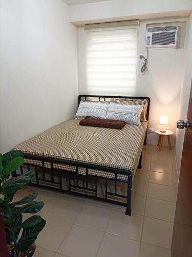 a bedroom with a bed in a room at Havenscape Staycation in Manila