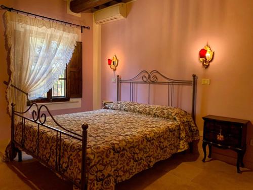 Ένα ή περισσότερα κρεβάτια σε δωμάτιο στο Agriturismo Santa Luce
