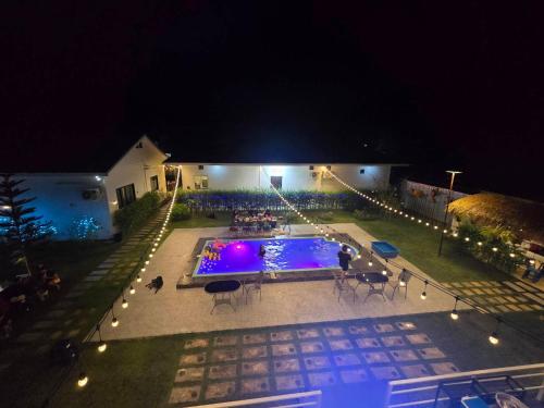 an overhead view of a swimming pool at night at Chaba1 in Nakhon Nayok