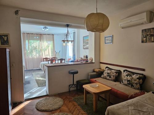 a living room with a couch and a table at Marina Bar in Bar