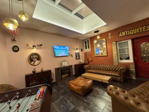 a living room with a couch and a pool table at Aggarthi Bed and Breakfast in Bayeux