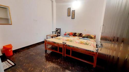 a bedroom with a bed in a room at Gladden Villa in Udaipur