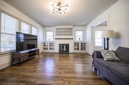a living room with a couch and a fireplace at Charming Retreat 5 Min to Tims Ford Lake Sleeps 8 in Winchester