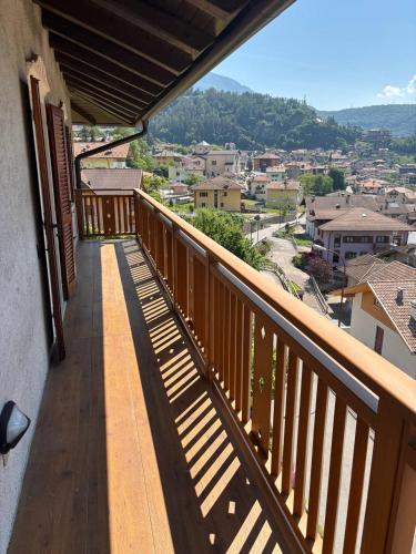 a balcony with a view of a city at Appartamento Bosco al Sole in San Lorenzo in Banale