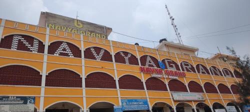 an orange building with a sign on top of it at Navya Grand Medchal in Hyderabad
