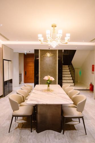 a large conference room with a table and chairs at Regal Victoria Luxury Pool Villa in Dien Ban