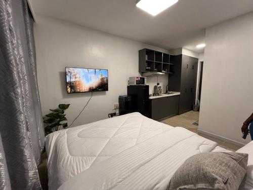 Ένα ή περισσότερα κρεβάτια σε δωμάτιο στο Ohana studio homes