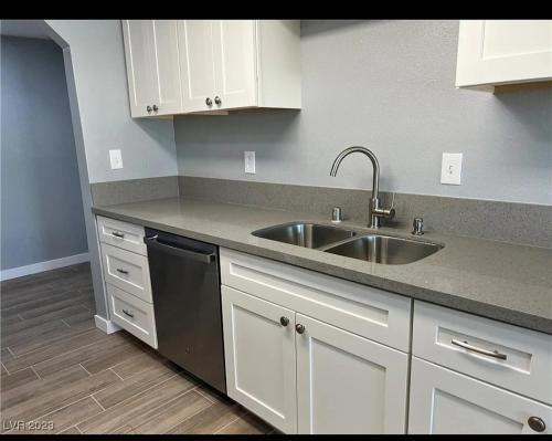 a kitchen with a sink and a dishwasher at Pool home in Las Vegas