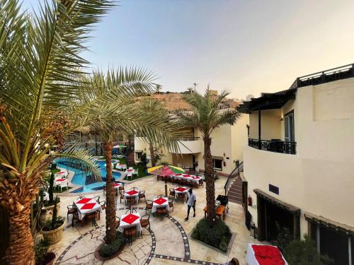 an overhead view of a courtyard with tables and palm trees at Naama Inn Hotel in Sharm El Sheikh