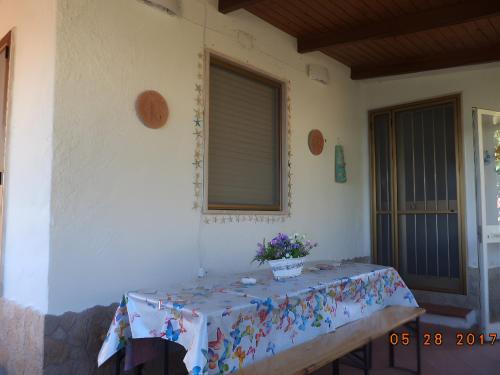 a table with flowers on it in a house at Villetta Mare Ventotene in Ventotene