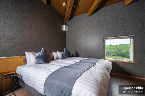 Кровать или кровати в номере Rusutsu Hills CENTRO