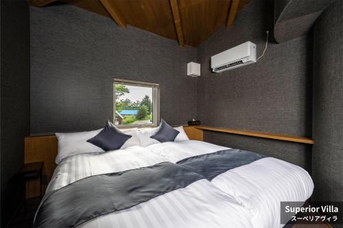 Кровать или кровати в номере Rusutsu Hills CENTRO