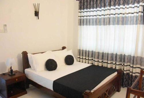 Postel nebo postele na pokoji v ubytování aloka resort