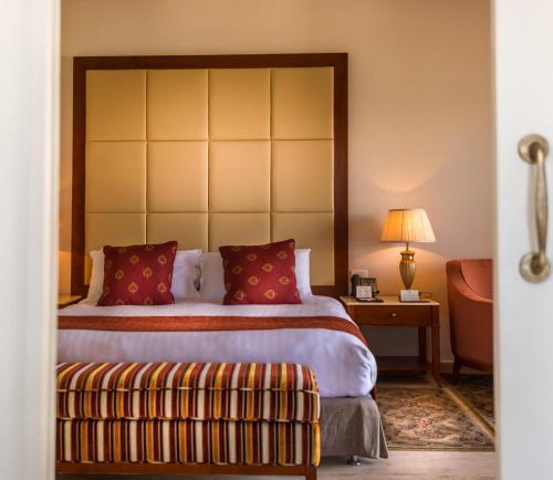 a hotel room with a bed and a couch at Baron Palace Sahl Hasheesh in Hurghada