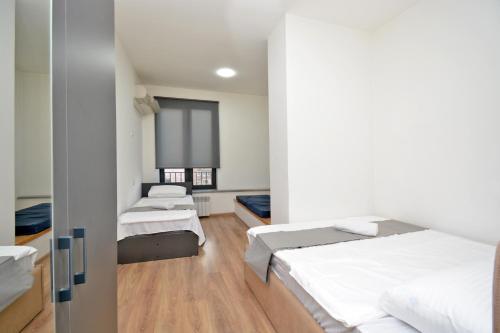 Postel nebo postele na pokoji v ubytování Wanderlust Guest House Inn Northern Avenue