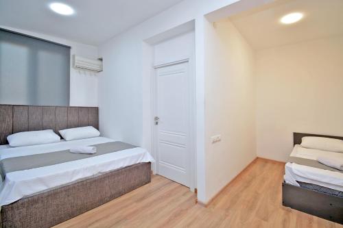 Postel nebo postele na pokoji v ubytování Wanderlust Guest House Inn Northern Avenue