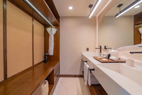 a bathroom with a sink and a mirror at Hotel Indigo La Paz Puerta Cortes by IHG in La Paz