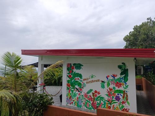 a kiosk with a painting of flowers on it at Mountain Guesthouse with Stunning Seaview Siquijor in Maria