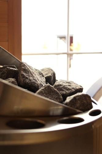 a pile of rocks sitting on top of a stove at Strandvilla Seelust in Schönberger Strand