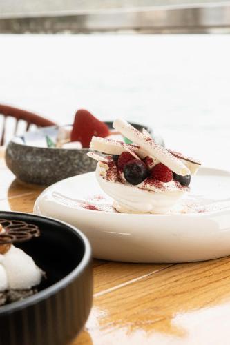 a dessert on a plate on a table at Elounda Akti Olous (Adults Only) in Elounda