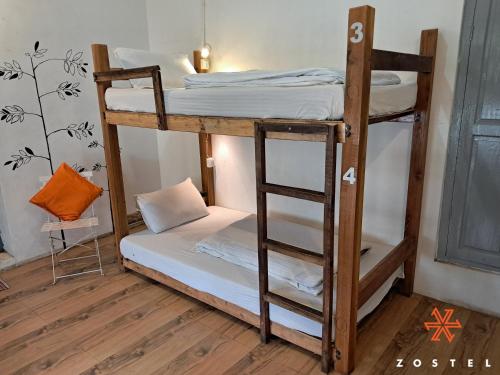 a couple of bunk beds in a room at Zostel Kodaikanal in Kodaikānāl