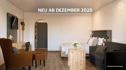 a hotel room with a bed and a couch at Pension Kohler in Fügen