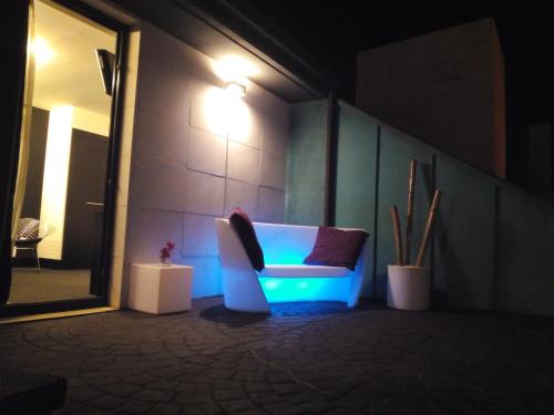 a room with a couch with a light on it at Hotel Playa Ribera in Suances