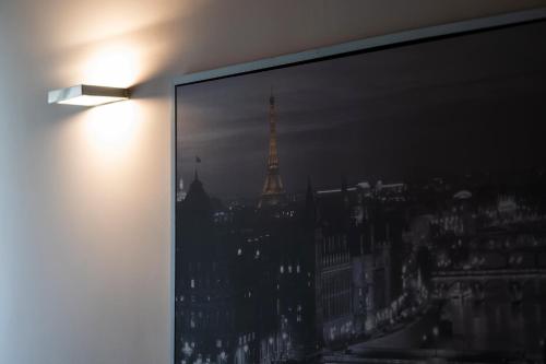 a large window with a view of the eiffel tower at Medieval Suite in Piazza Trento-Trieste Ferrara in Ferrara