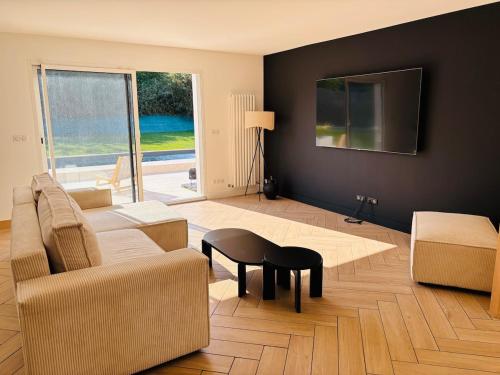 Khu vực ghế ngồi tại Évasion à 2h de Paris avec piscine chauffée privée