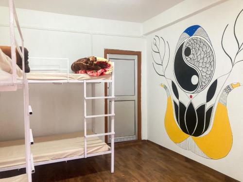 Postel nebo postele na pokoji v ubytování Aavya backpackers hostel