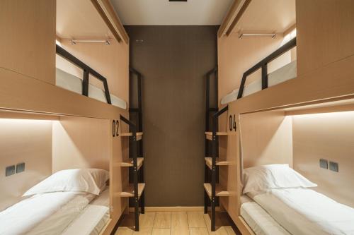Captain 5 Youth Hotel-Shanghai Laoshan Road Branchにあるベッド
