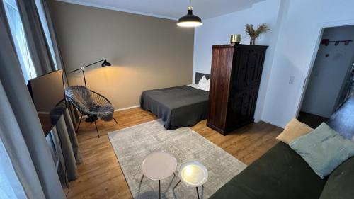 Χώρος καθιστικού στο discovAIR Eisenach - 3-Zi- Apartment Matteo- Schwimmbad-Nah mit Netflix