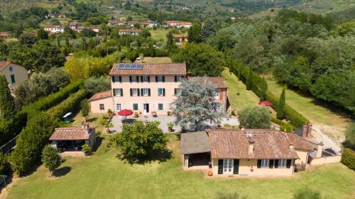 an aerial view of a large estate with a house at Villa al Falchetto by VacaVilla in Capannori