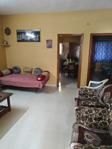 a living room with two couches and a couch at Mahi's HomeStay in Nashik