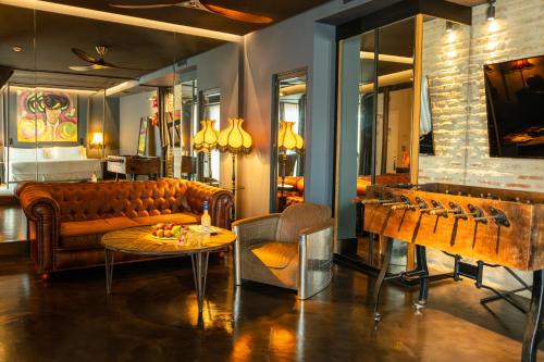 a living room with a couch and a table at Hotel Lobby in Seville
