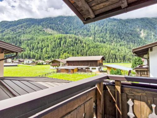 a view from the balcony of a house with a mountain at Apartment Max by Interhome in Winkle