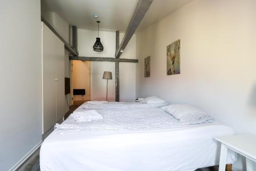 a bedroom with a large white bed in it at Worker & families Dream Apartment in the heart of Gothenburg in Gothenburg