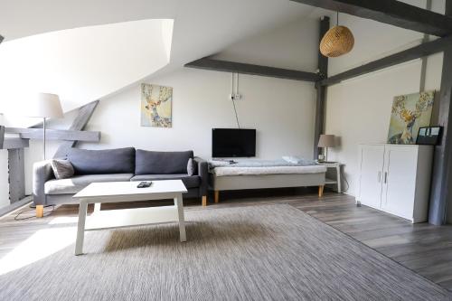 a living room with a couch and a table at Worker & families Dream Apartment in the heart of Gothenburg in Gothenburg