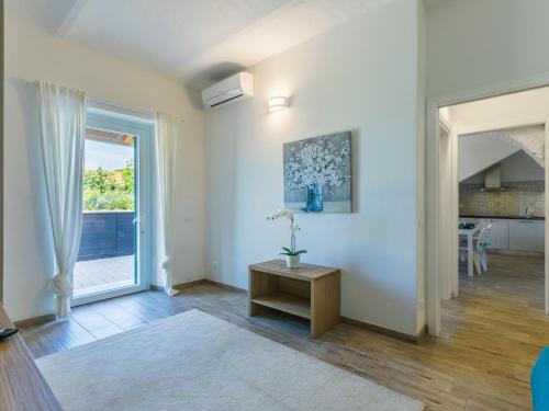 a living room with a table and a window at Holiday Home Da Lisa by Interhome in Fiorino