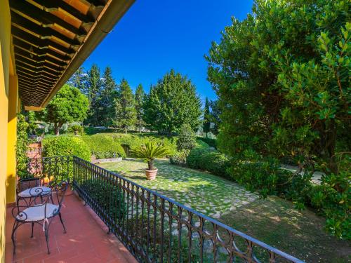 a balcony with a fence and a table and chairs at Holiday Home Villa Silvana by Interhome in Marcialla