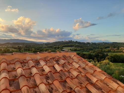 a red tile roof with a view of the countryside at B&B La Casetta in Montecarlo
