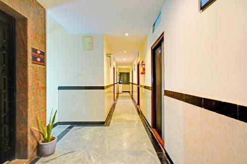 a corridor of a building with a hallway at FabHotel AIG Broholic - 250M from AIG Hospital, Gachibowli in Hyderabad