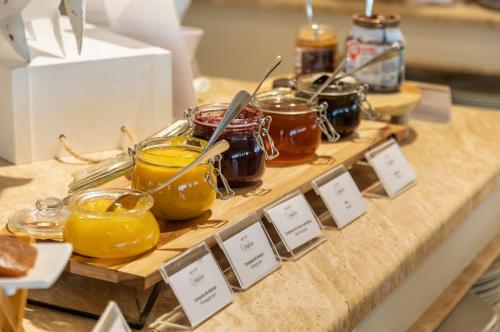 a table with jars of honey and jars of lemons at Crowne Plaza Vilamoura - Algarve by IHG in Vilamoura