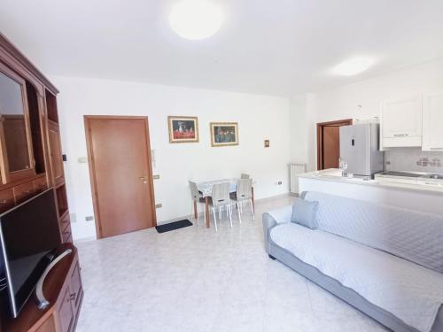 a living room with a couch and a table at Siderea House in Chioggia