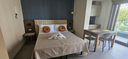 Frontemare Appartamenti e Camere ELISABETTAにあるベッド